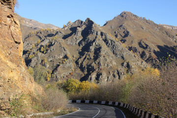 Mountain asphalt road against the backdrop of a picturesque landscape.