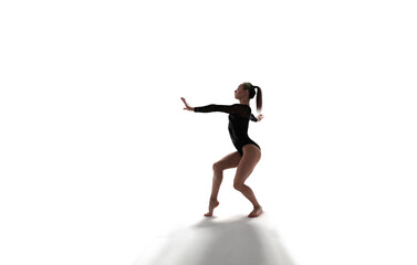 Fototapeta na wymiar Female gymnast doing a complicated trick isolated on white.