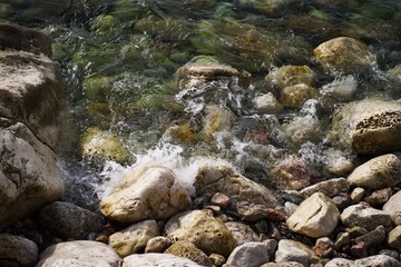 Sea water beats against stones