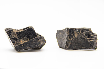 Natural black coals isolated in white background. Two dirty coals stones.