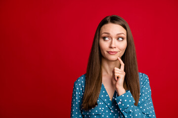 Close-up portrait of attractive minded girl overthinking copy empty space place isolated on bright red color background