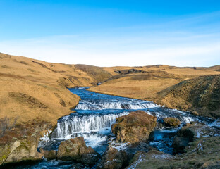 A small cascade just before the river reaches the Skogafoss waterfall, Iceland.