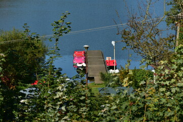 Pedal boats moored to the pier, view from the top, Kashubia, Poland.