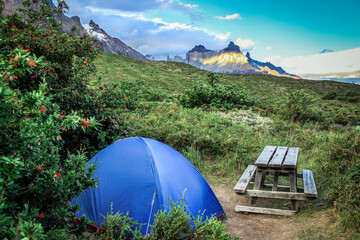 View to a tent with Los cuernos in the background near the lake pehoe in torres del paine - Chile
