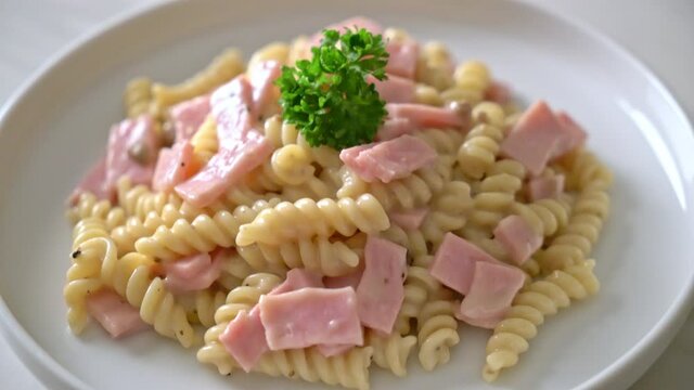 spirali or spiral pasta mushroom cream sauce with ham - Italian food style