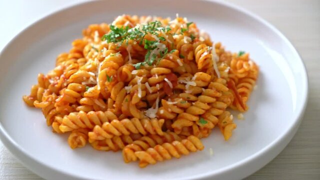 spiral or spirali pasta with tomato sauce and cheese - Italian food style