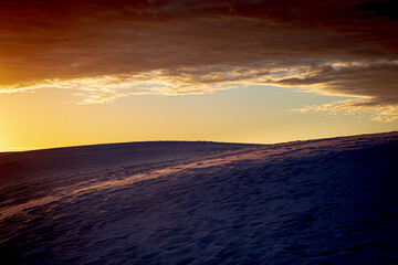 Fototapeta na wymiar Dawn breaks over the Dunes in White Sands National Park, New Mexico