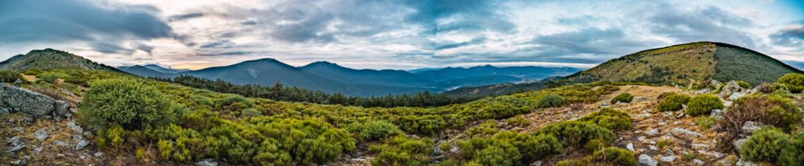 Mountain panorama with a cloudy sunrise