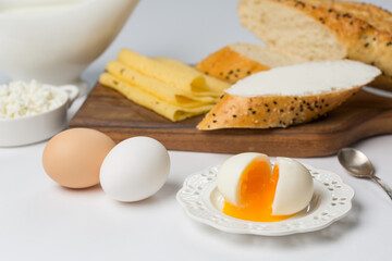 Healthy breakfast, boiled eggs, cheese and bread