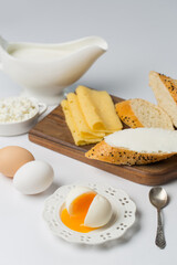 Healthy breakfast, boiled eggs, cheese and bread