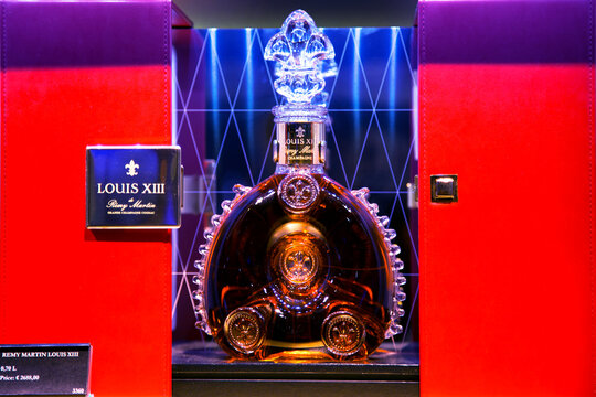 NETHERLANDS, AMSTERDAM, MAY, 29, 2014: Alcohol boutique in Duty Free Shop at Schiphol Amsterdam International Airport. LOUIS XIII Cognac by Rémy Martin, a unique decanter of exquisite luxury cognac th