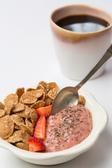 Wholegrain flakes and strawberry and  banana smoothie and black coffee