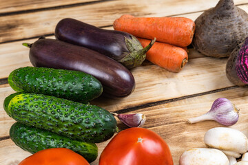 Assortment of fresh vegetables on wood background
