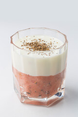 Layer of strawberry and banana smoothie and white yoghurt