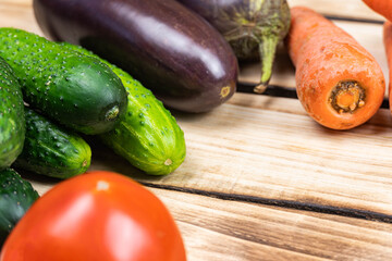 Assortment of fresh vegetables on wood background