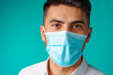 Handsome mixed-race man wearing medical face mask