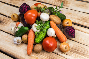 Assortment of fresh vegetables on wood background