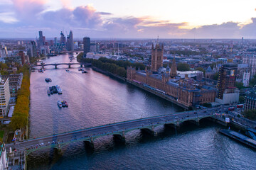 London city river Thames, houses of parliament and big ben viewed from London eye near Westminster bridge at dusk sunset
