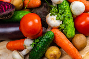 Assortment of fresh vegetables on wood background