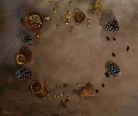 Flat lay of brown table top with Christmas decor. Copy space