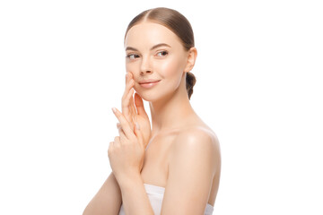 Beauty portrait of young woman looking rightwards, holding hands near face with clean skin, isolated on white background