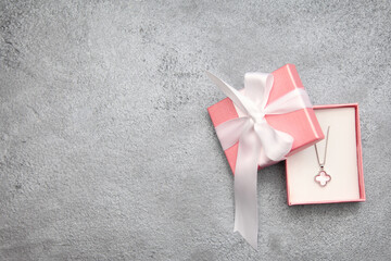 The perfect piece of jewelry for a perfect holiday! gift box with ribbon, Jewelry in a pink gift...