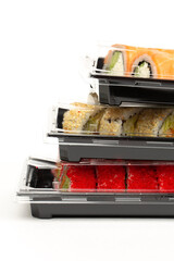 Food delivery concept, sushi in plastic container delivered to home