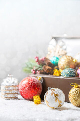 Leather suitcases in retro style full of Christmas tree decorations. Christmas holiday concept.