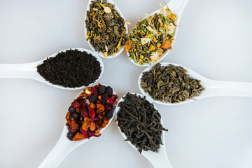 Assortment of dry tea. Various kinds of tea isolated on white.Different kinds of tea leaves. Tea...