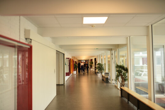 A School Hallway With Kids Walking