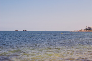 Fototapeta premium Calm sea, blue water, sky and horizon scene in Tunisia.