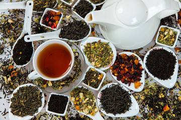 Assortment of dry tea. Various kinds of tea isolated on white.Different kinds of tea leaves. Tea...