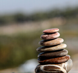 Pyramid of sea stones. Sea background. SPA