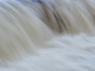 Fototapeta na wymiar waterfall, white water stream, long exposure abstract background
