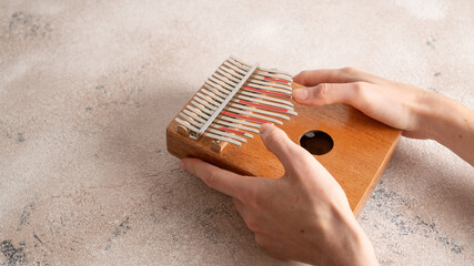 Kalimba 17 key notes thumb piano. Kalimba or mbira is a wooden resonant African musical instrument....