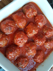 Koftes with tomato sauce in oven