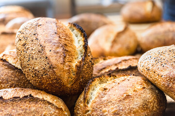 Various rustic bread on a wooden board. Healthy food and farming concept