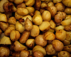 background of Golden fried new potatoes close-up