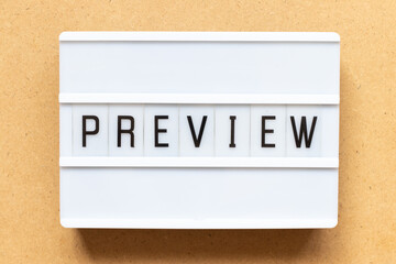Lightbox with word preview on wood background