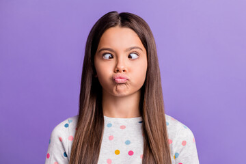 Photo portrait of silly girl grimacing looking at nose pouting isolated on vivid violet colored background - obrazy, fototapety, plakaty
