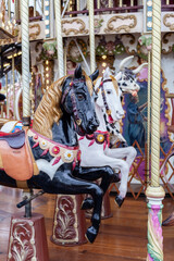 A merry go round carousel with colourful horses