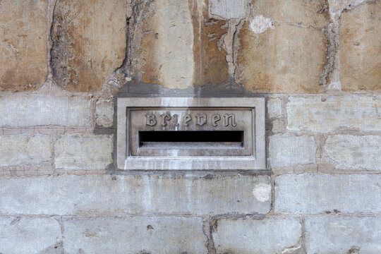 Old stone mailbox in the centre of Bruges (Translation: Brieven means Letters)