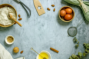 Fototapeta na wymiar Ingredients for baking sugar-free cake with honey. Flour, eggs, honey, nuts, spices on a gray background, top view, flat lay, copy space. Homemade honey pie recipe