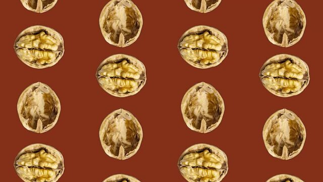 Walnuts Flowing Vertically and Rotating. 4K, 60 fps, loop video of walnuts