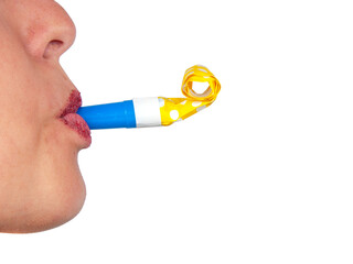 Party whistle in mouth on the white