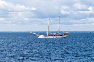 Old ship with two masts with lowered sails