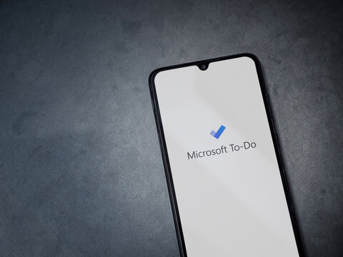 Lod, Israel - July 8, 2020: Microsoft To Do app launch screen with logo on the display of a black mobile smartphone on dark marble stone background. Top view flat lay with copy space.