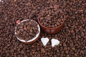 Cup of coffee on the coffee beans background