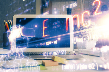 Desktop computer background and formula hologram writing. Double exposure. Education concept.