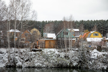 Fototapeta na wymiar small village with colorful houses covered with snow